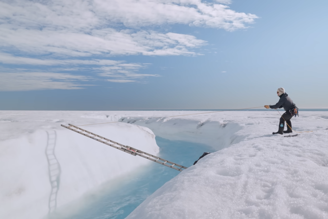 Setting a ladder bridge across a glacial stream.